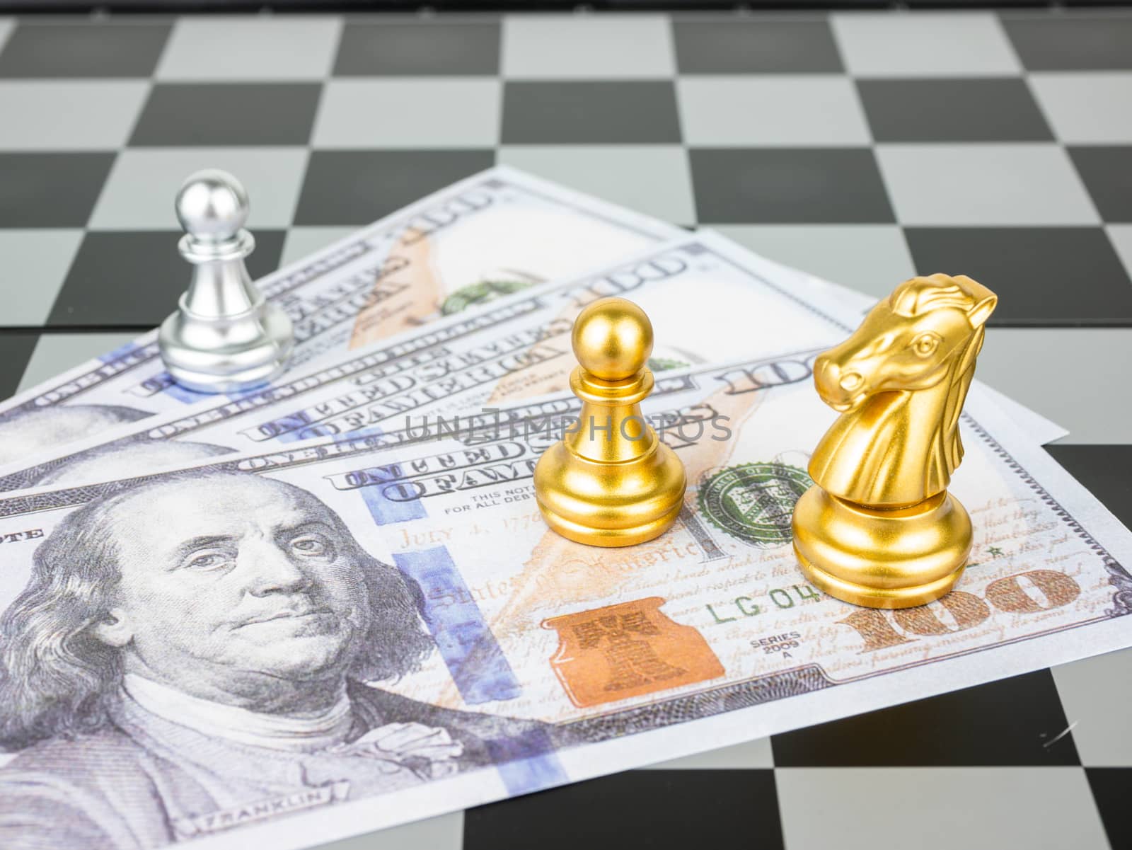 Financial games concept, Game of chess with dollar money, select by Amankris