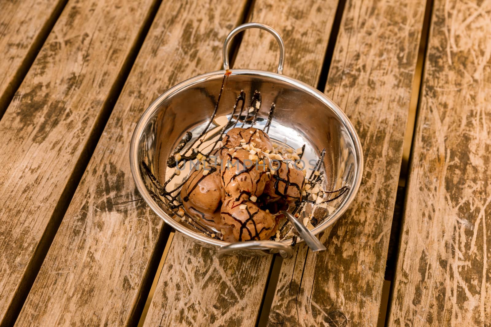 Chocolate ice cream in a silver bowl by camerarules