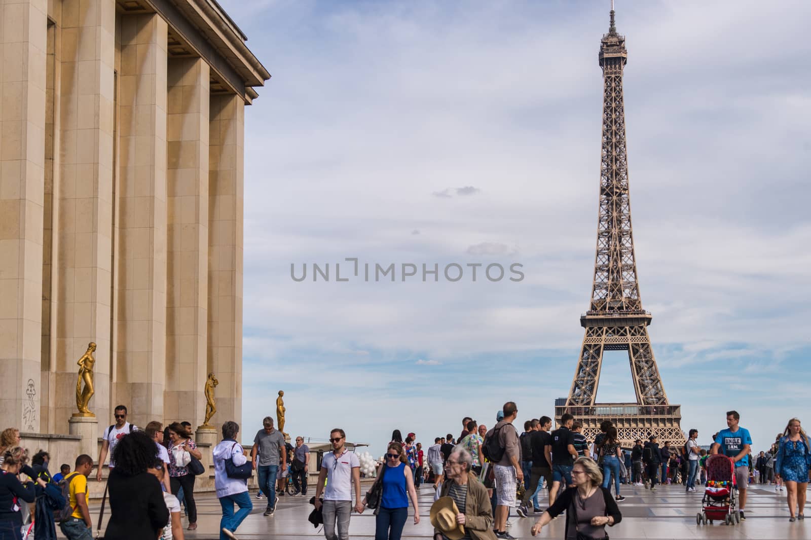 Paris, France - 23 June 2018: Eiffel Tower from Trocadero with many tourists in the foreground