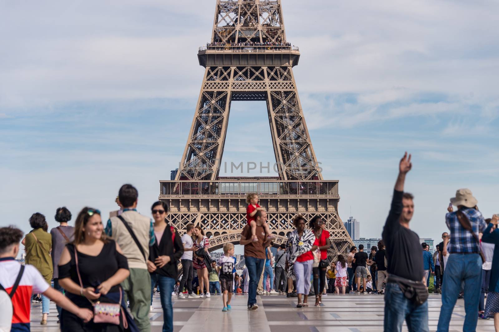 Paris, France - 23 June 2018: Eiffel Tower from Trocadero with many tourists in the foreground