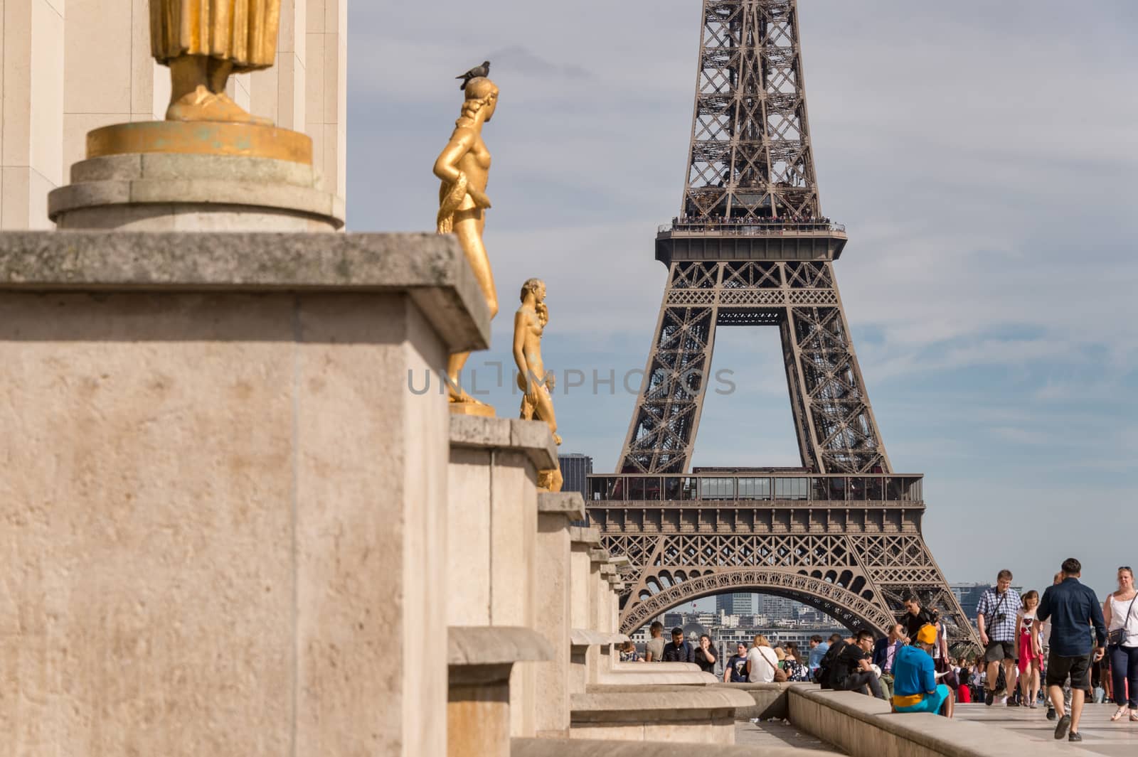 Paris, France - 23 June 2018: Eiffel Tower from Trocadero with many tourists in the foreground