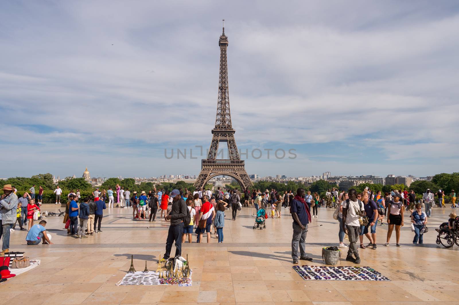 Paris, France - 23 June 2018: Eiffel Tower from Trocadero with many tourists in the foreground
