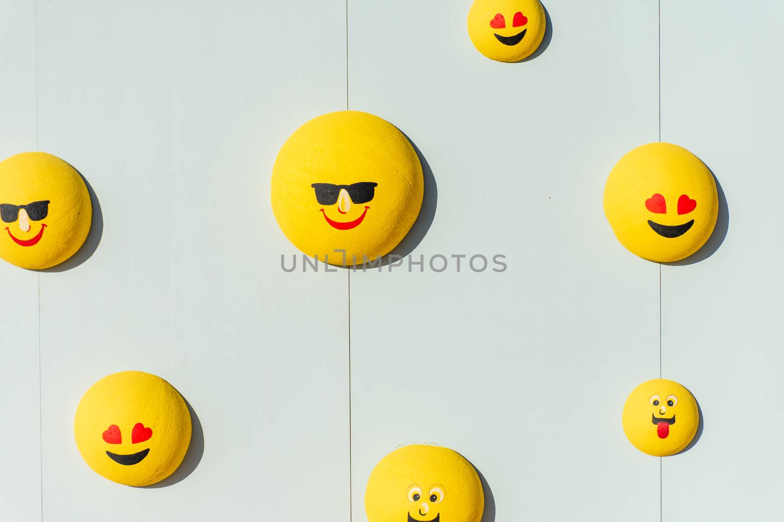 Wall bubble yellow emojis or emoticons for a street festival. Happiness, valentine's day, and joy concpets.