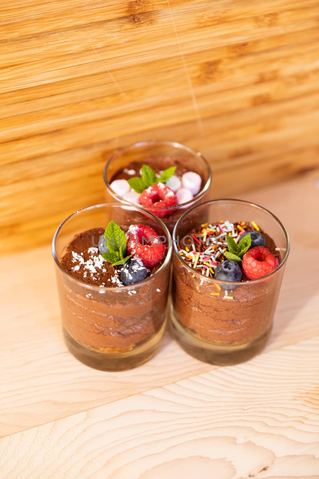 Group shot with glasses filled with chocolate mousse by camerarules