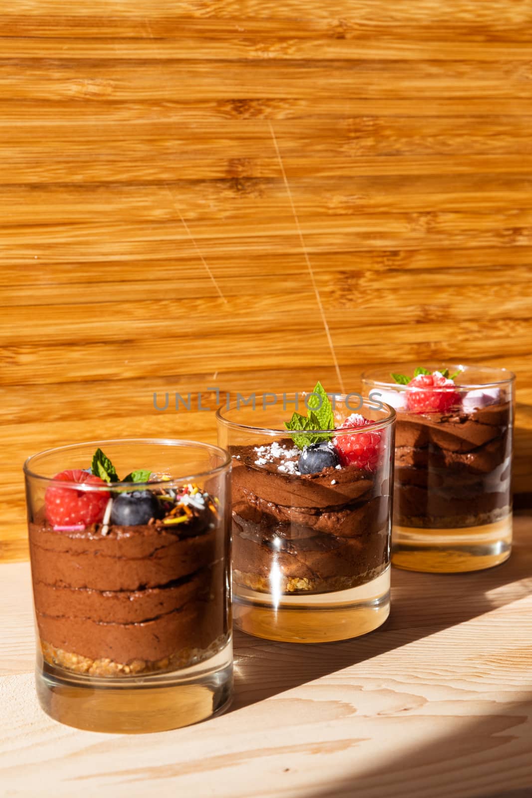 Group shot with glasses filled with chocolate mousse