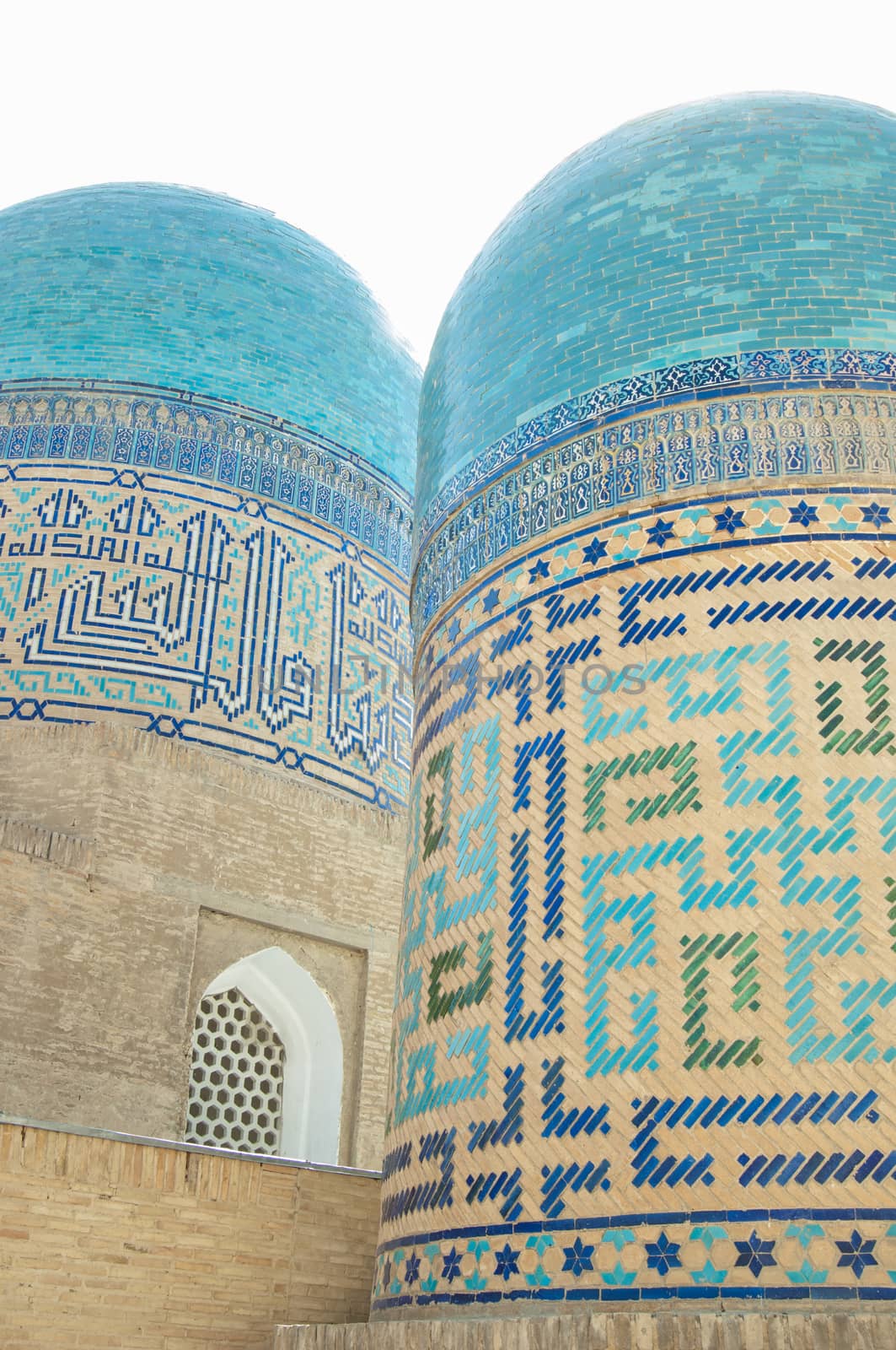 Domes and towers of Registan in Samarkand. Ancient architecture of Central Asia