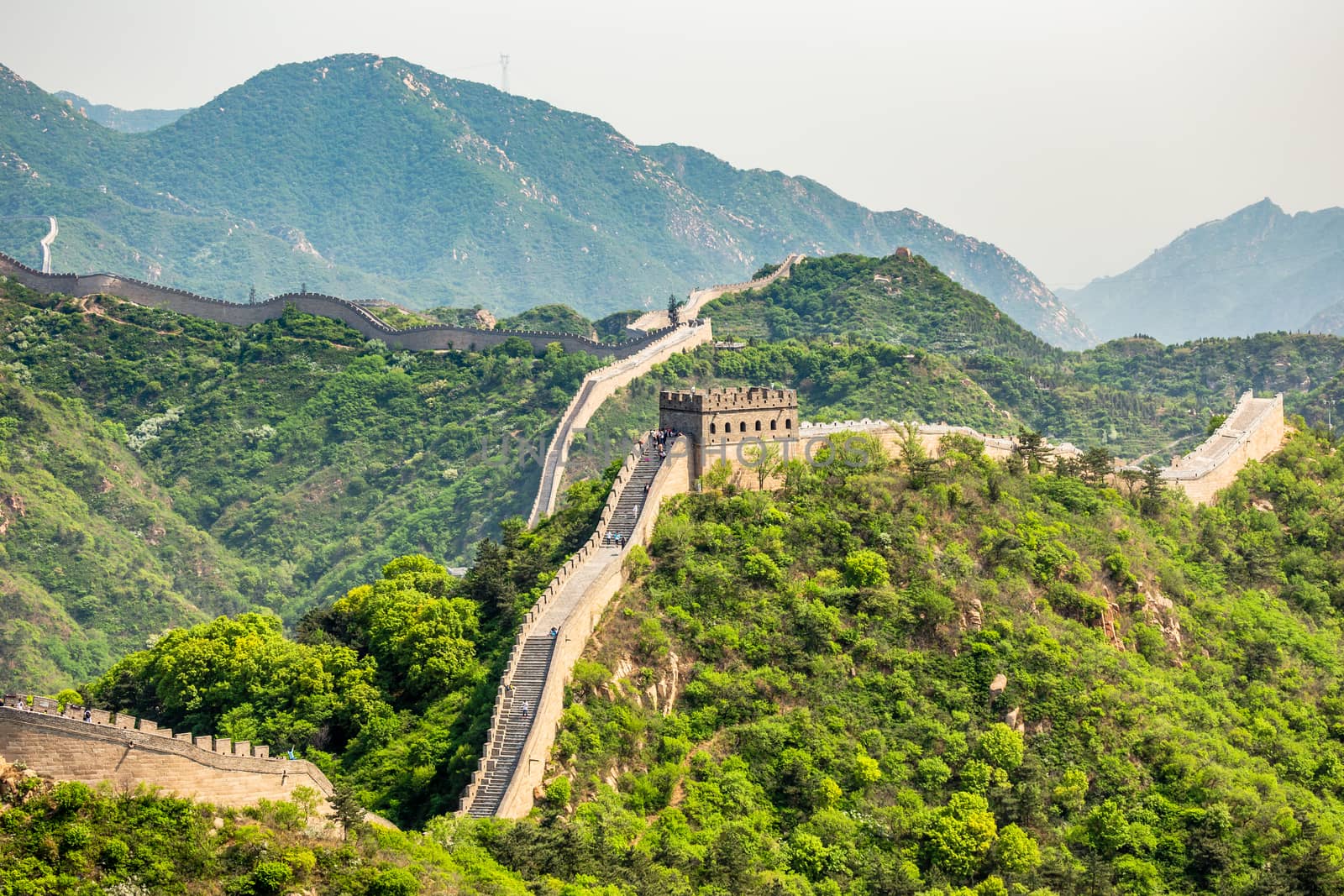 Panorama of Great Wall of China among the green hills and mountains near Beijing, China