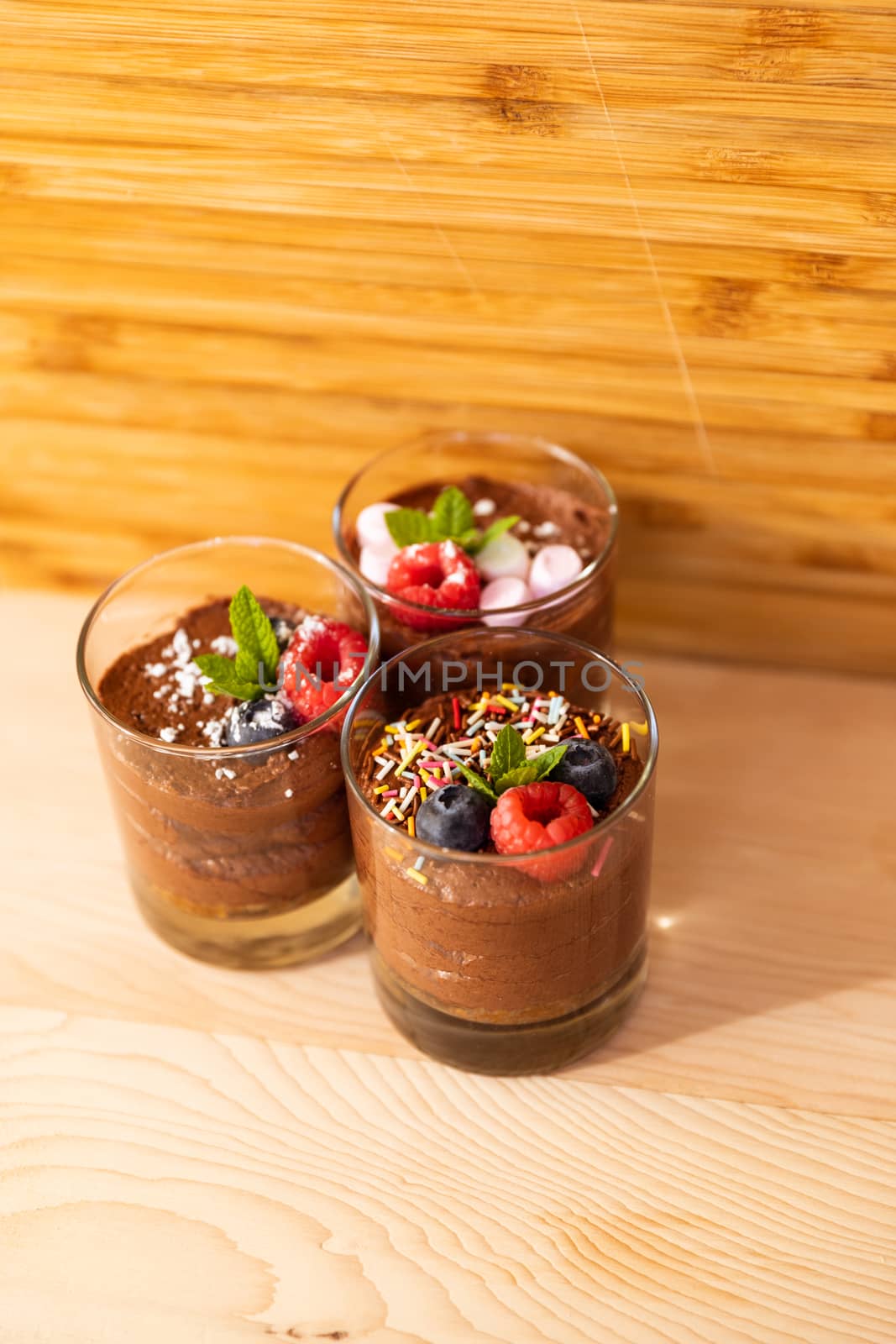 Group shot with glasses filled with chocolate mousse