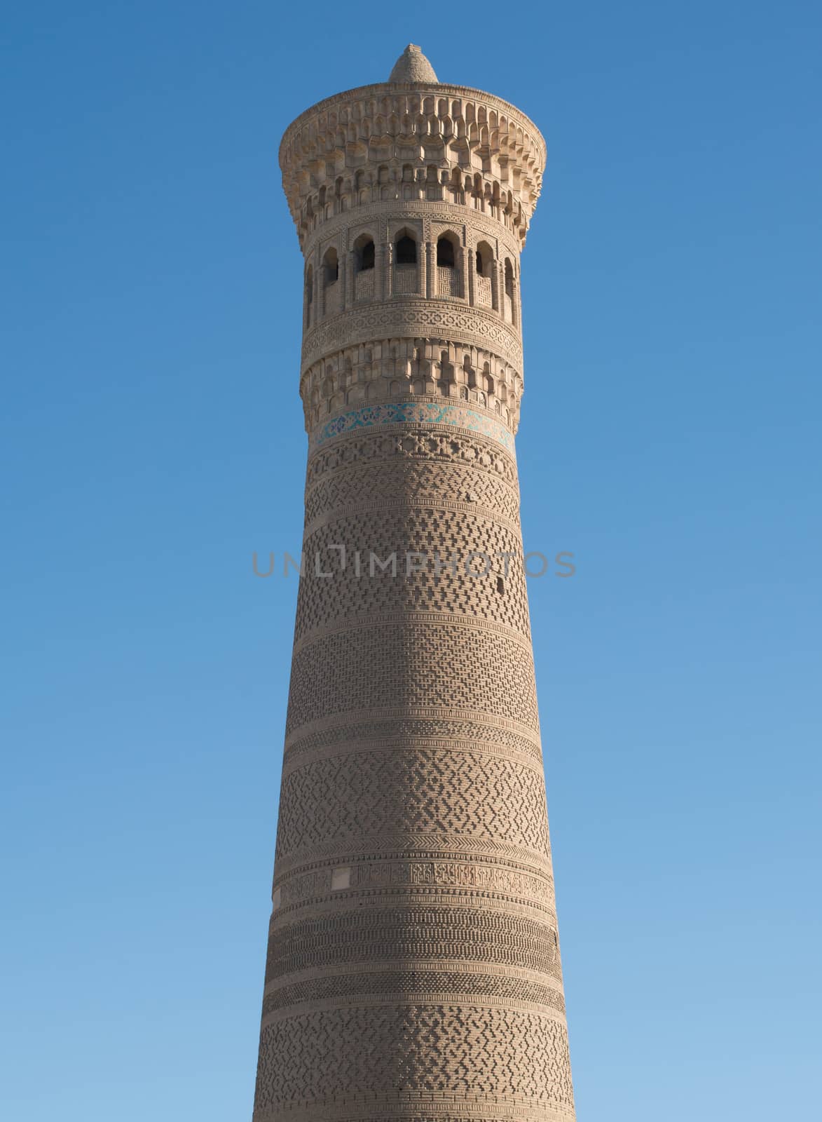 High oval tower of bricks, ancient Asian buildings. the details of the architecture of medieval Central Asia