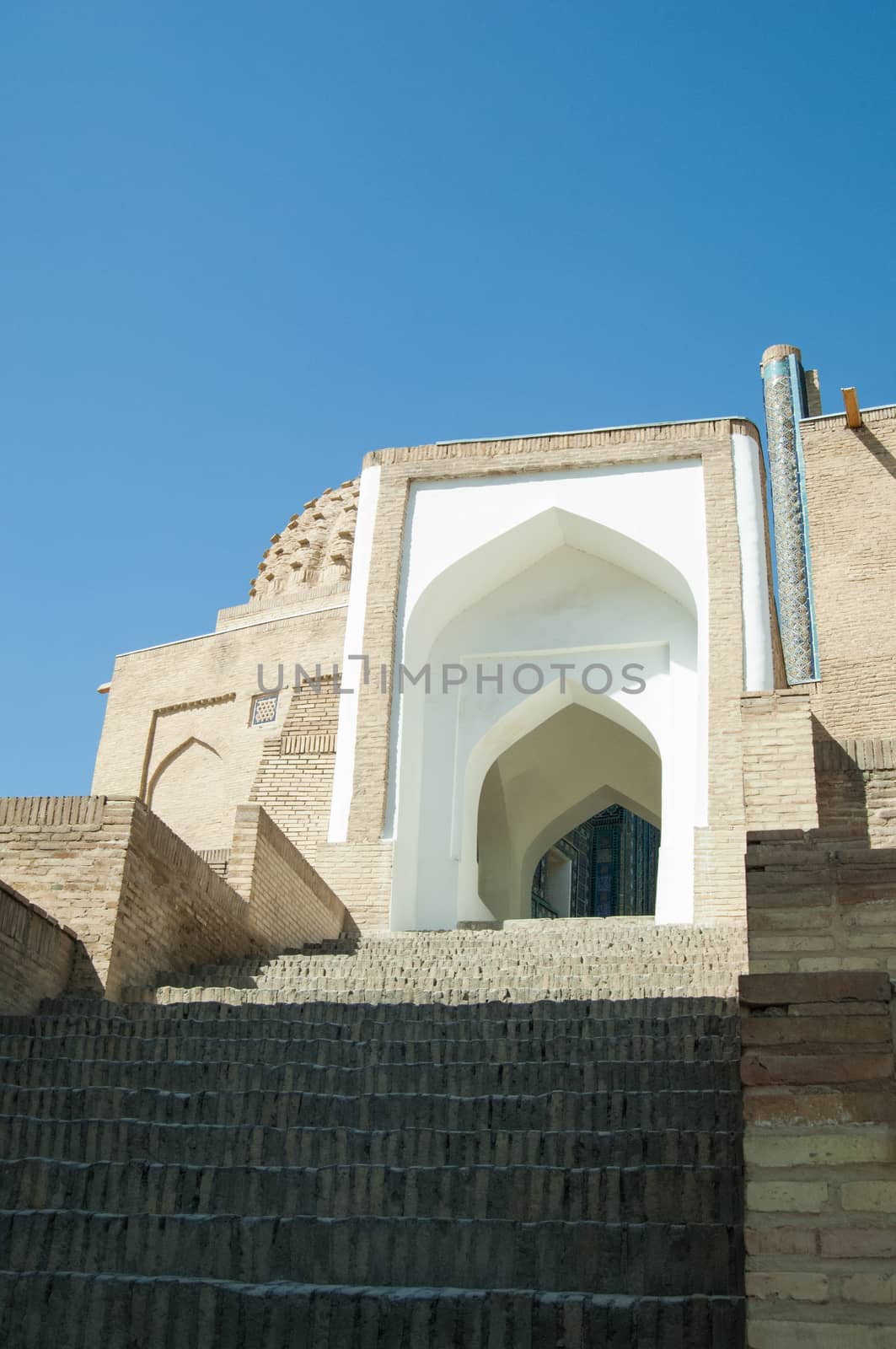 The arch and steps, the exterior design of the ancient Registan in Samarkand. Ancient architecture of Central Asia. Ancient architecture of Central Asia