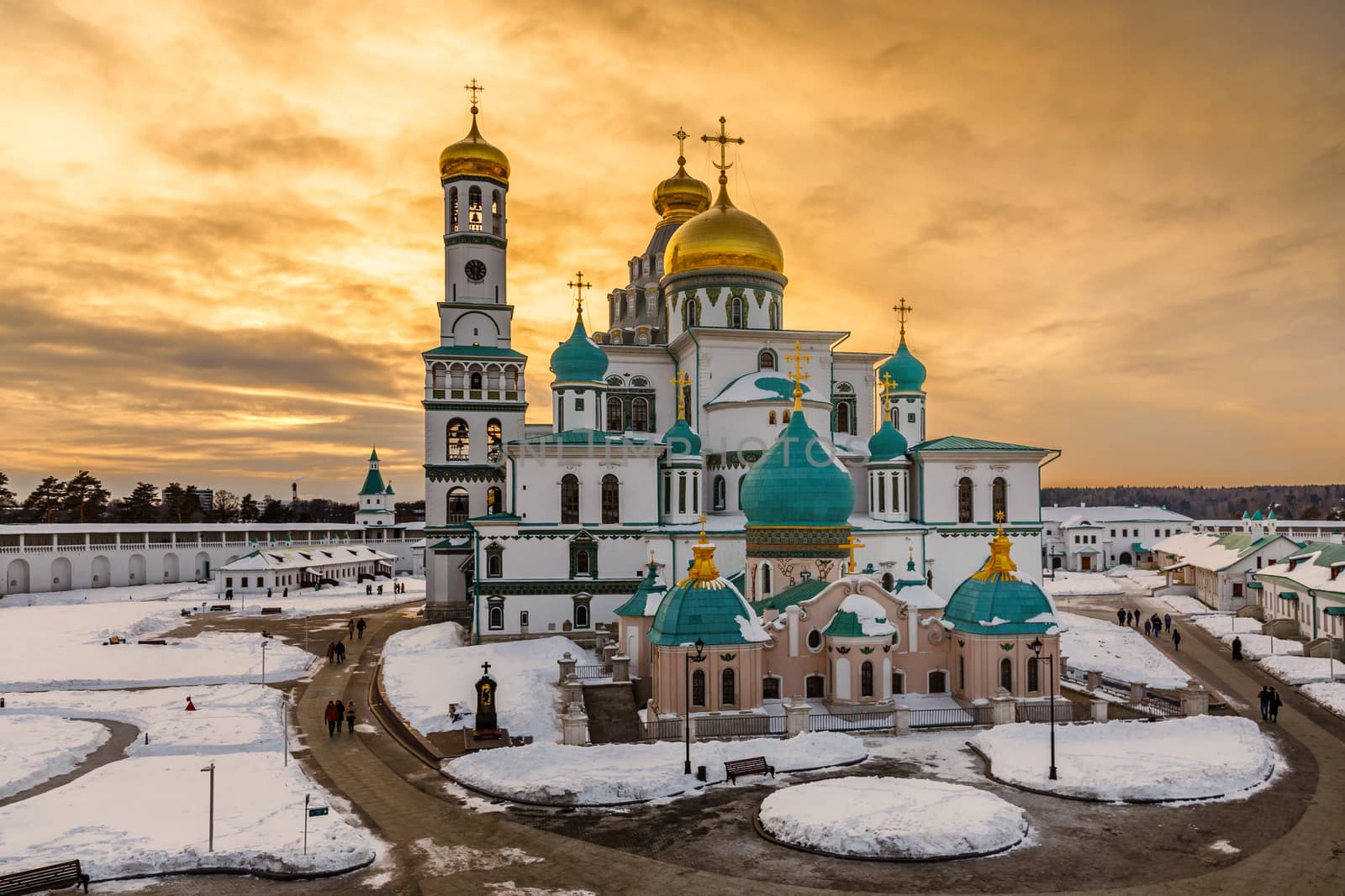 Voskresensky cathedral golden domes in a sunset light, covered in snow, Resurrection or New Jerusalem Monastery, Istra, Moscow region, Russia