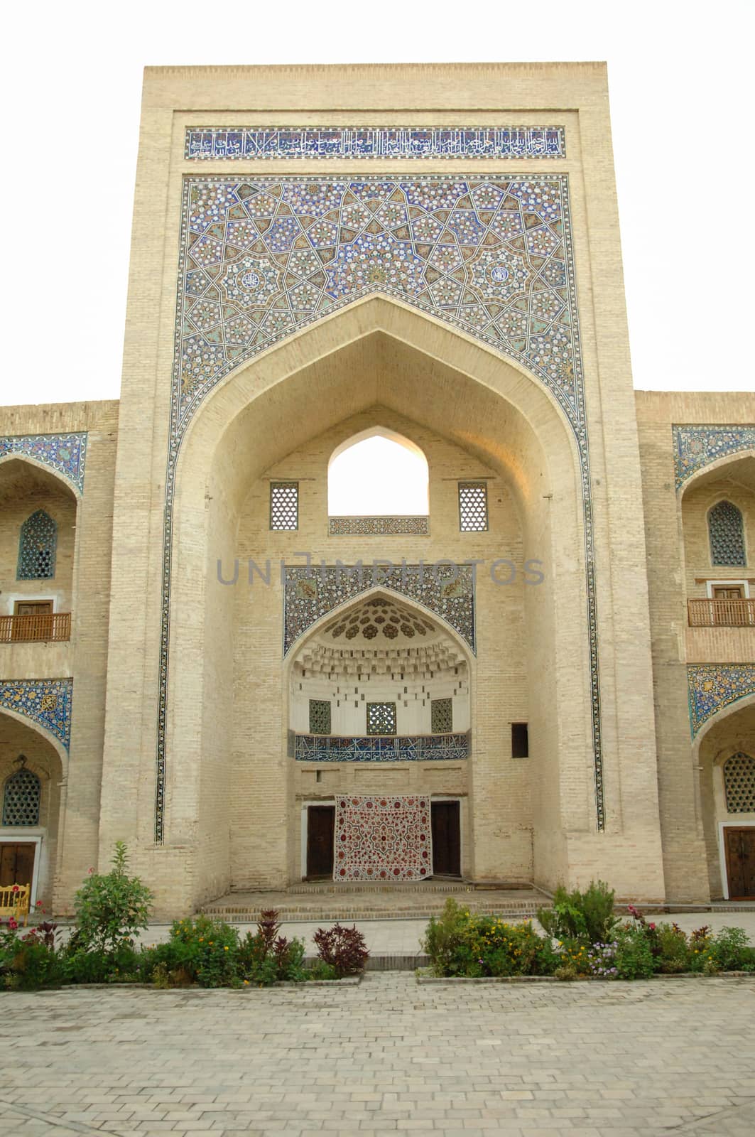 High arch and door with traditional Oriental mosaic. the ancient buildings of medieval Asia