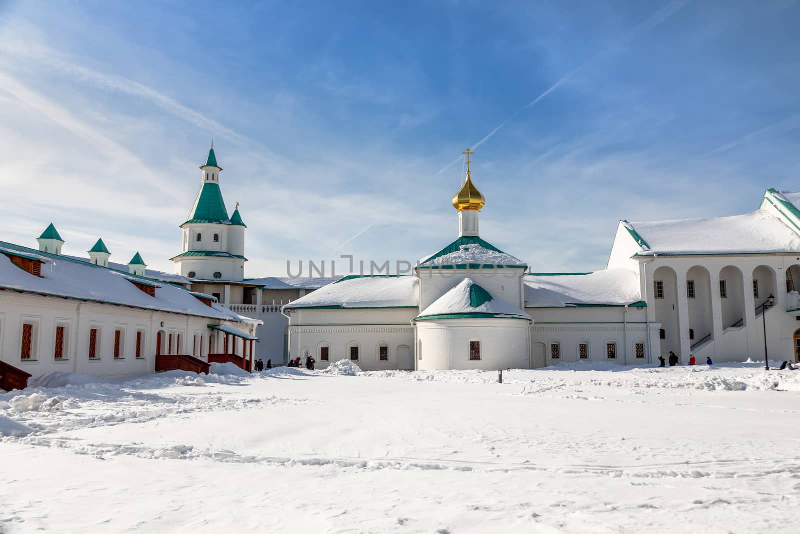 New Jerusalem Monastery inner yard with church and buildings covered in snow, Istra, Moscow region