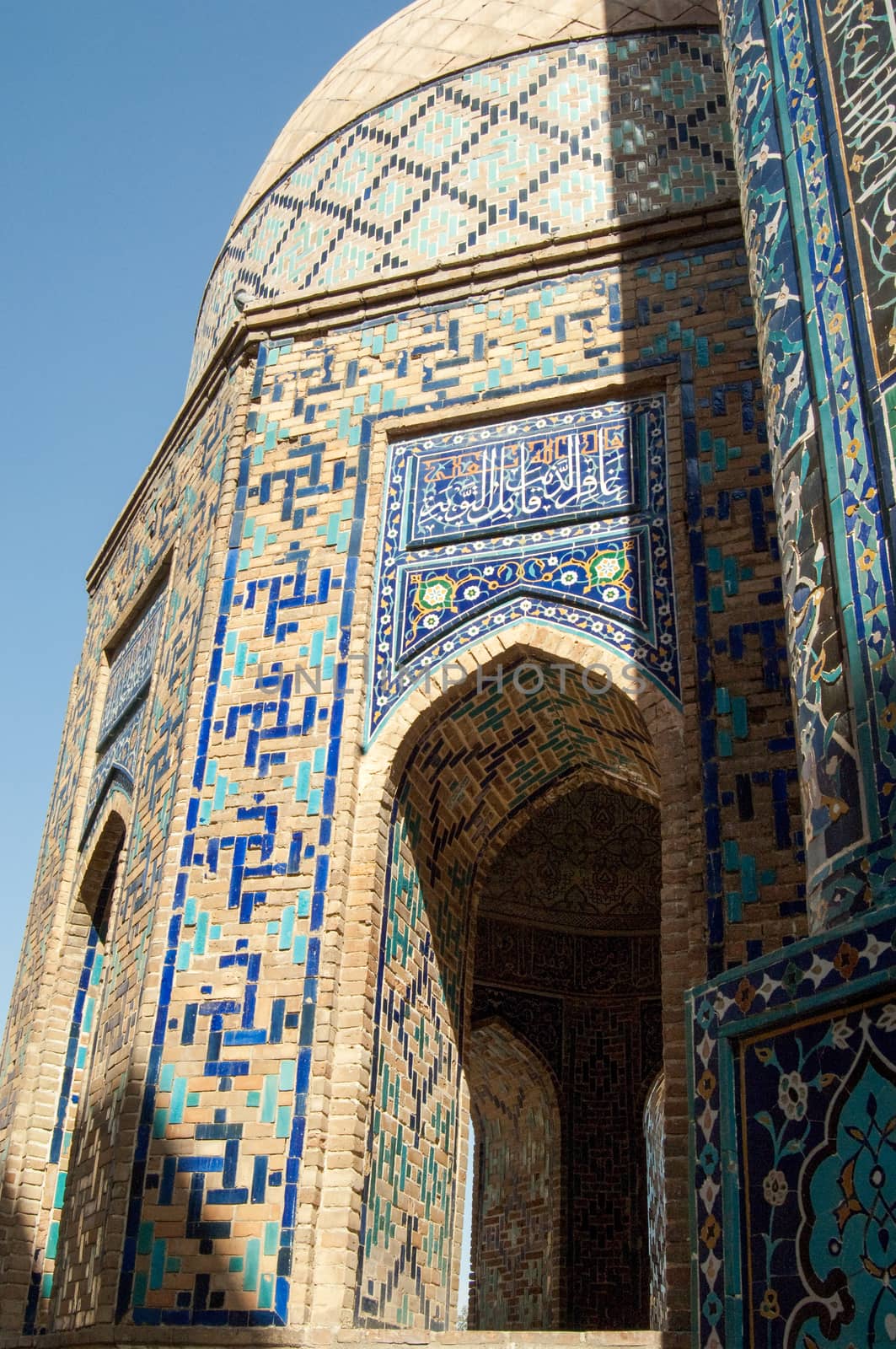 The arch and the exterior design of the ancient Registan in Samarkand. Ancient architecture of Central Asia