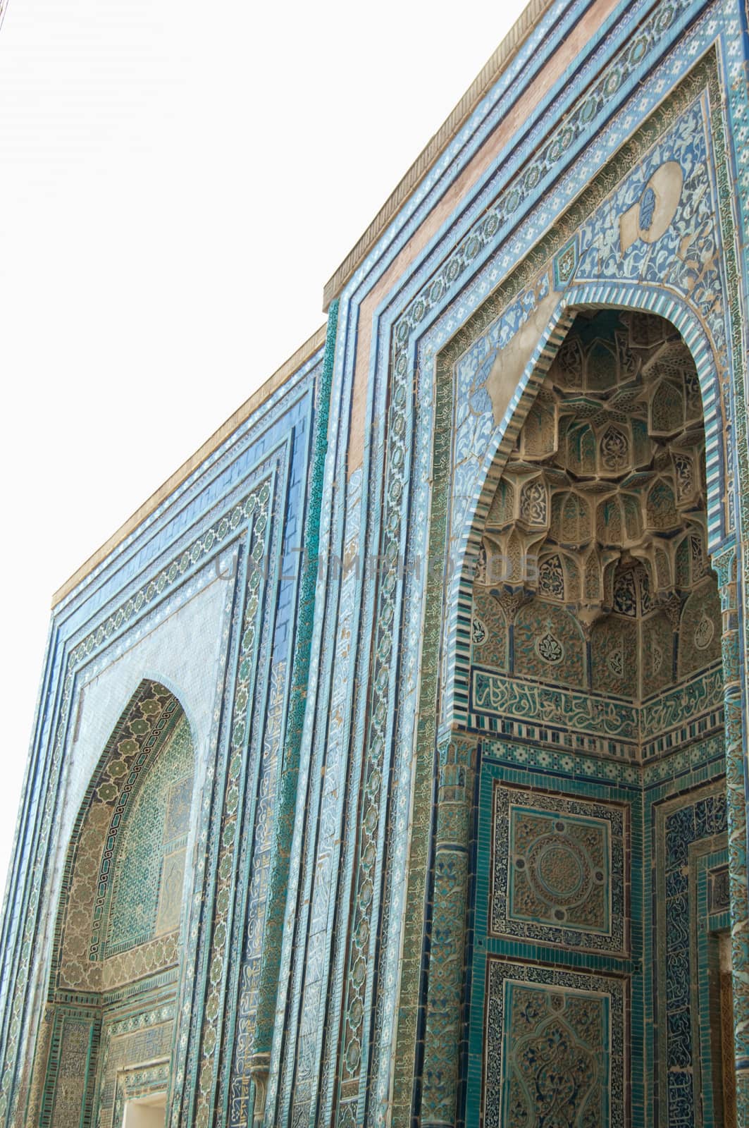 The arch and the exterior design of the ancient Registan in Samarkand. Ancient architecture of Central Asia