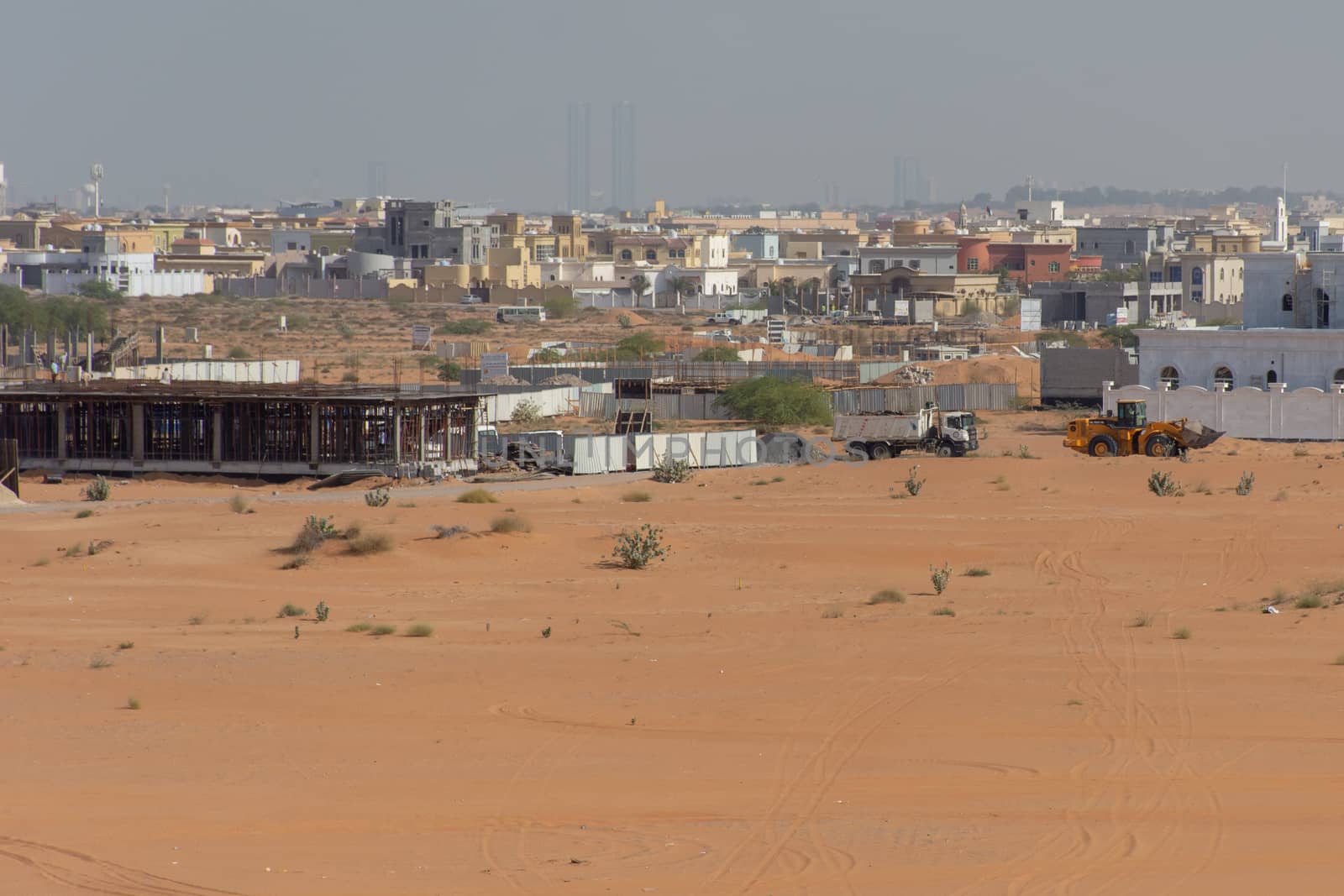Residential Housing Development in the United Arab Emirates with trucks and machines.