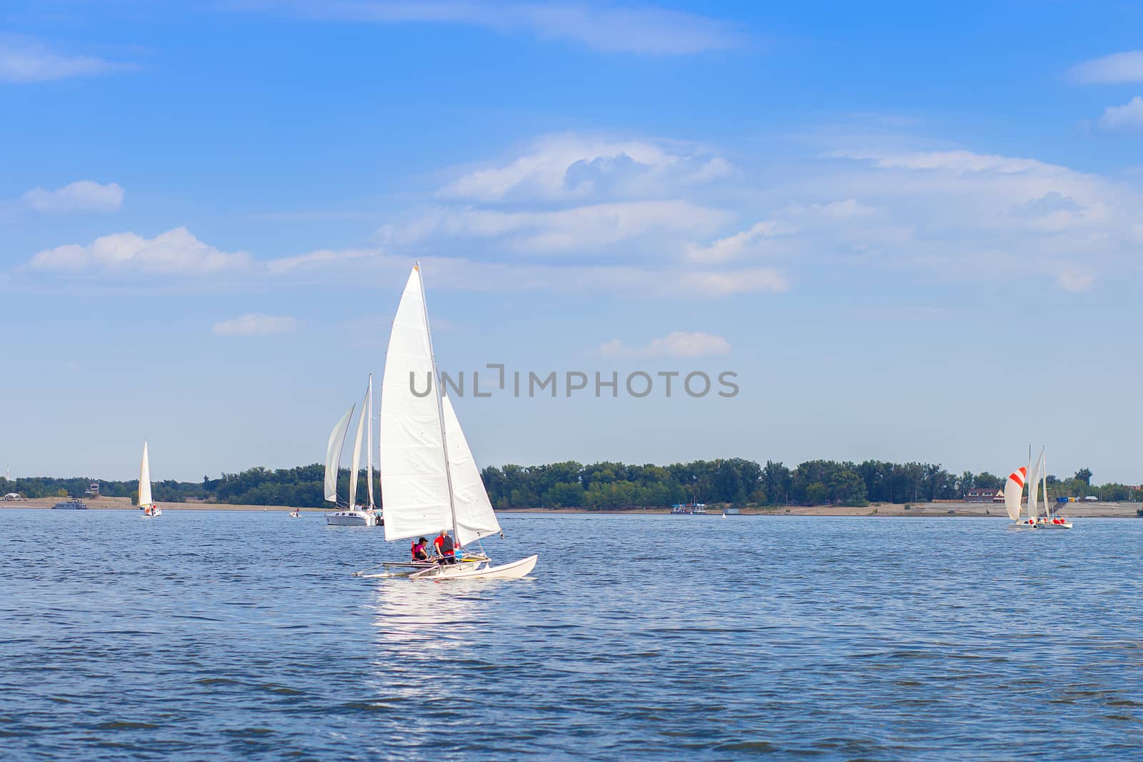 Competition among yachts with sails on the water of the Volga River