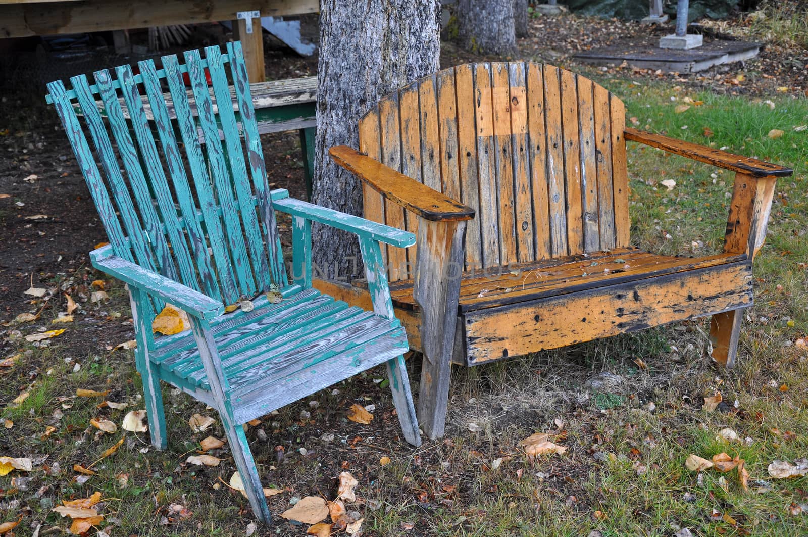 Old wooden chairs outside in autumn