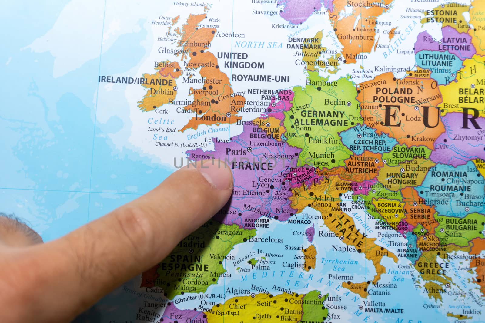 "RAK, RAK/UAE - 5/19/2019: Finger pointing to a colorful country map of Paris, France in Europe"