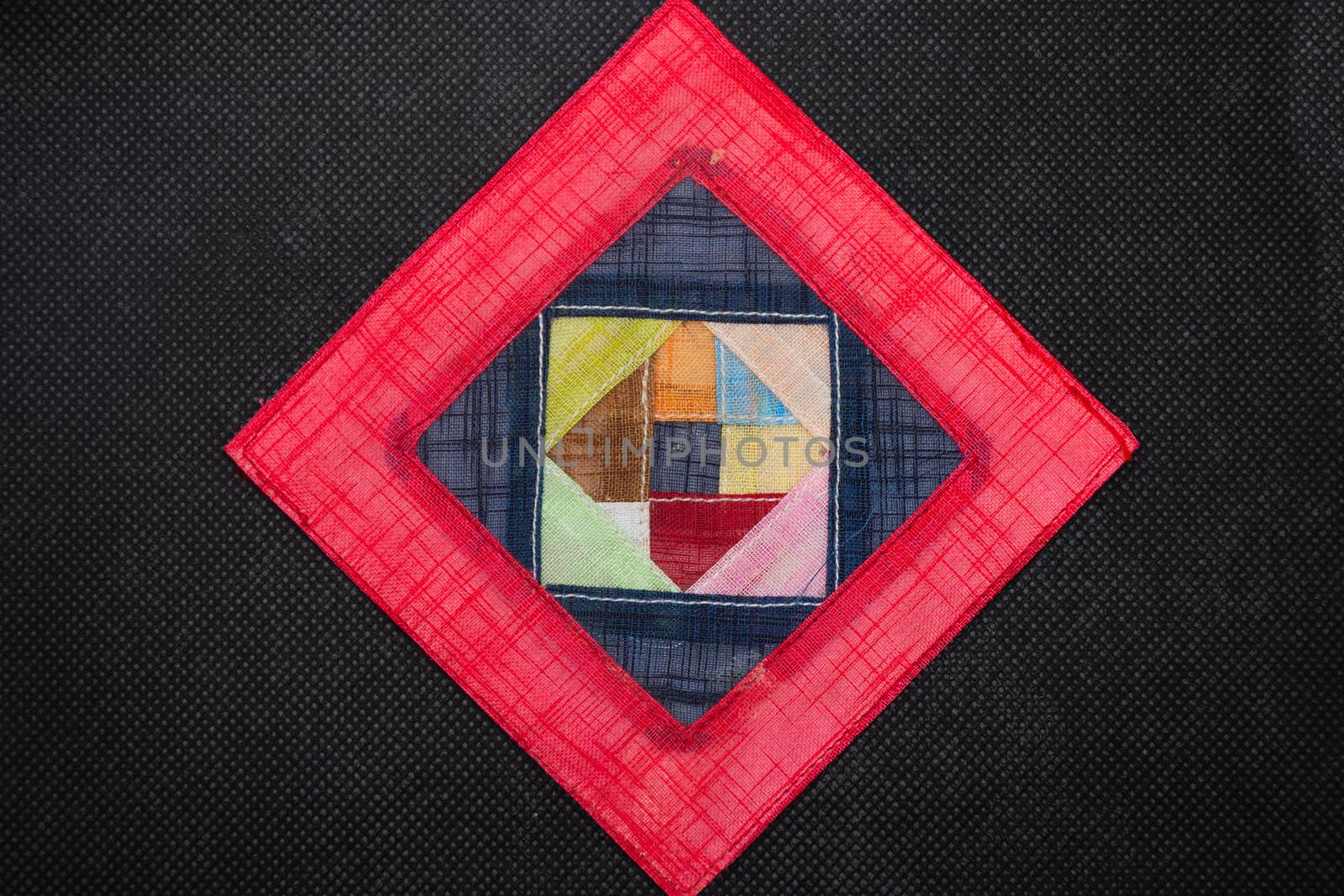 Geometric flat lay black background,  vivid colors of pink and red triangle shapes. Open concept.