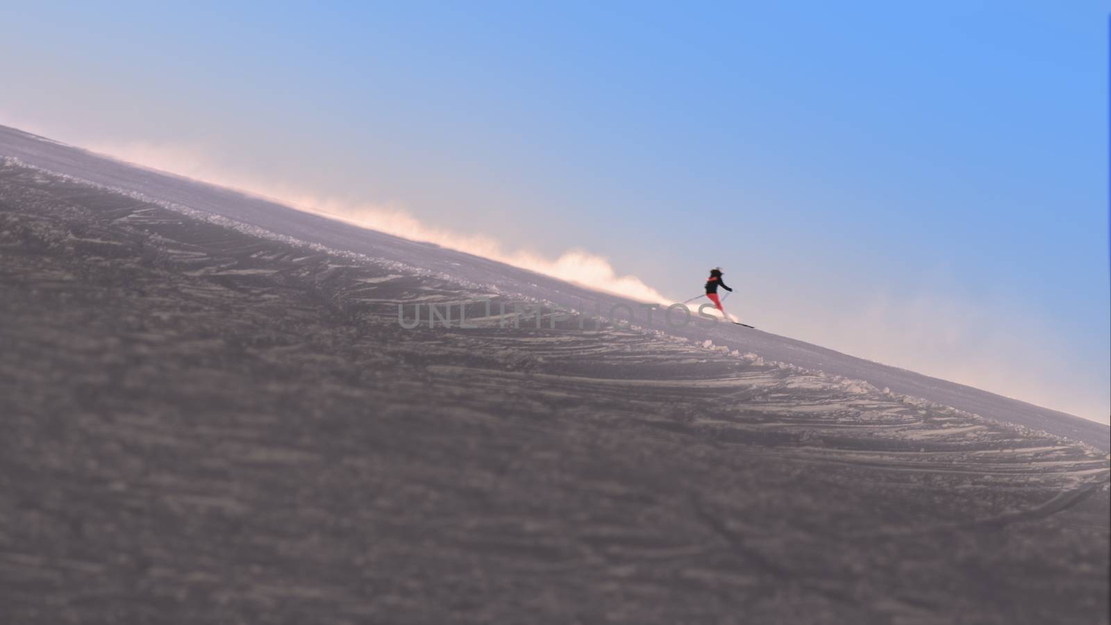 Skier enjoying the slopes in the morning at the Austrian Alps near Innsbruck