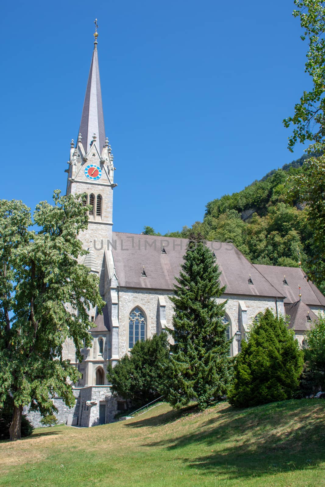 "Vaduz, Vaduz/Liechtenstein -  08/09/2018: Vaduz Cathedral in Liechtenstein near Switzerland on a sunny day with blue skies."