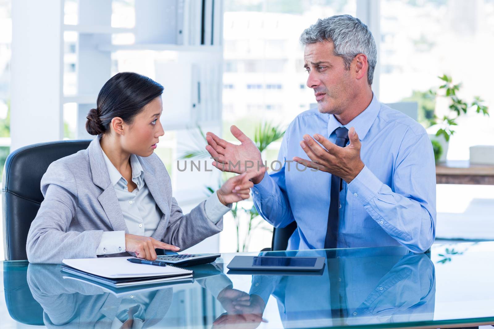 Business people having argument in office