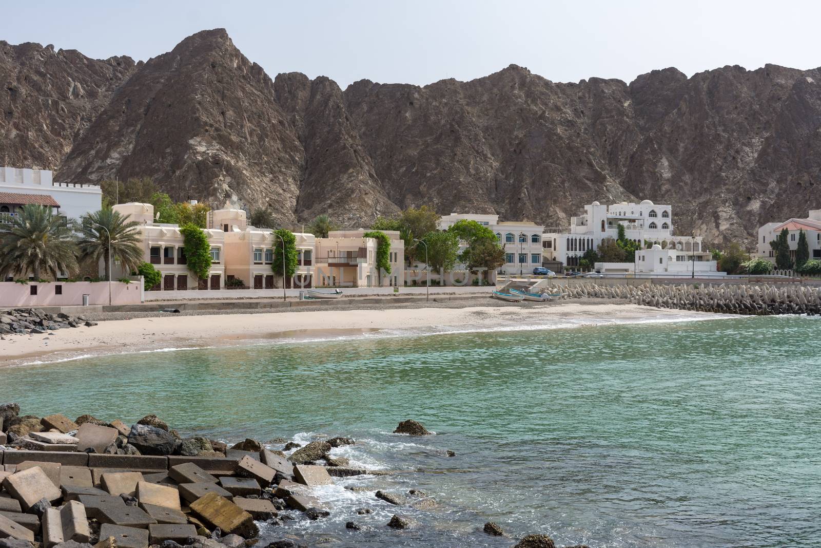 Spectacular Omani Coastline near Old Town in Muscat, Oman by the Corniche in the morning showing off the beautiful mountains and the Gulf of Oman.