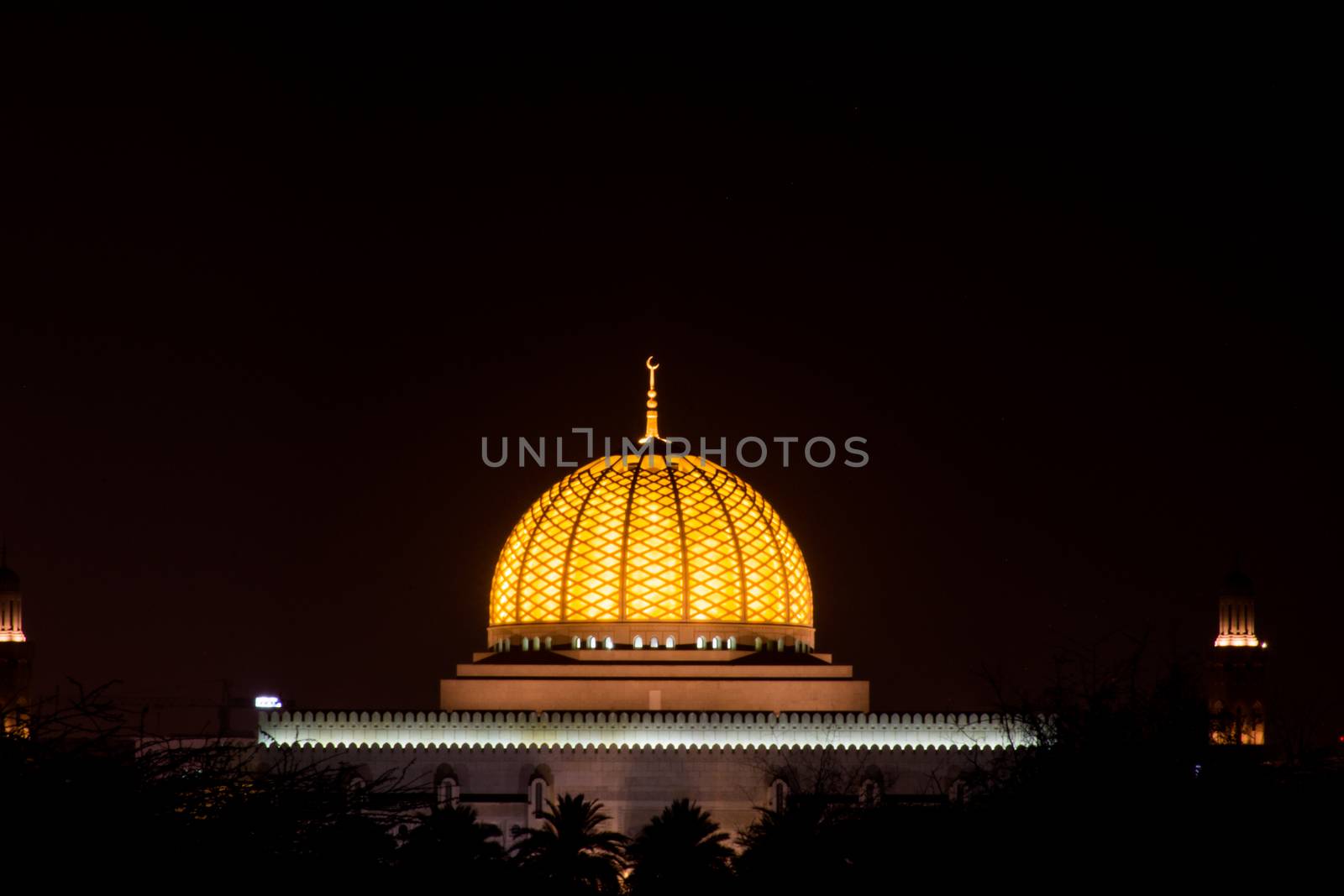 Glowing center dome of an Islamic mosque Sultan Qaboos Grand Mos by kingmaphotos