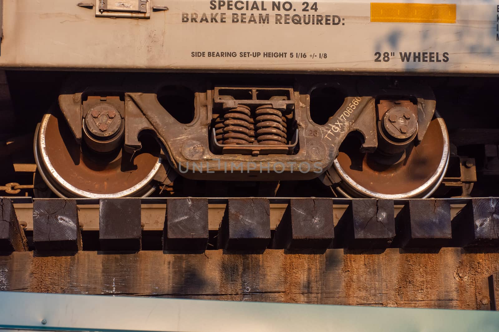 Close up of train wheels and break system in motion on track on  by kingmaphotos