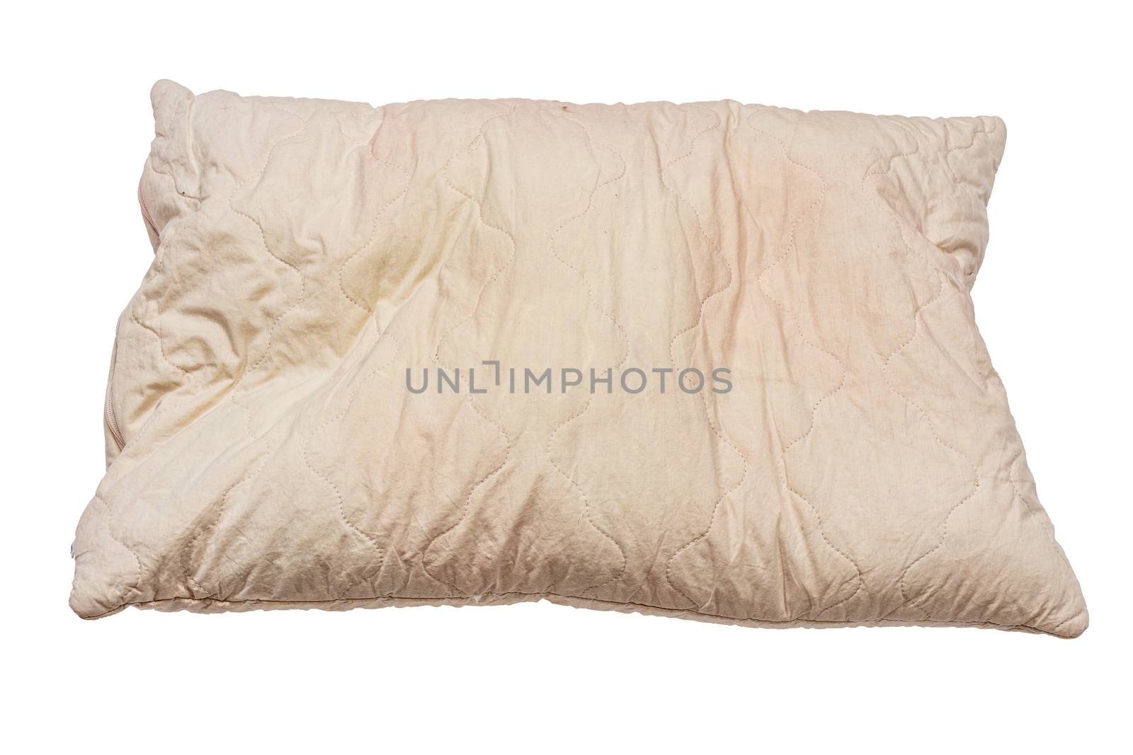 dirty used spotted nasty pillow isolated on white background in slanted frontal perspective.