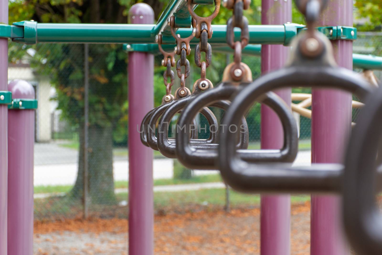 Empty monkey bars at a playground side view concept looking thro by kingmaphotos