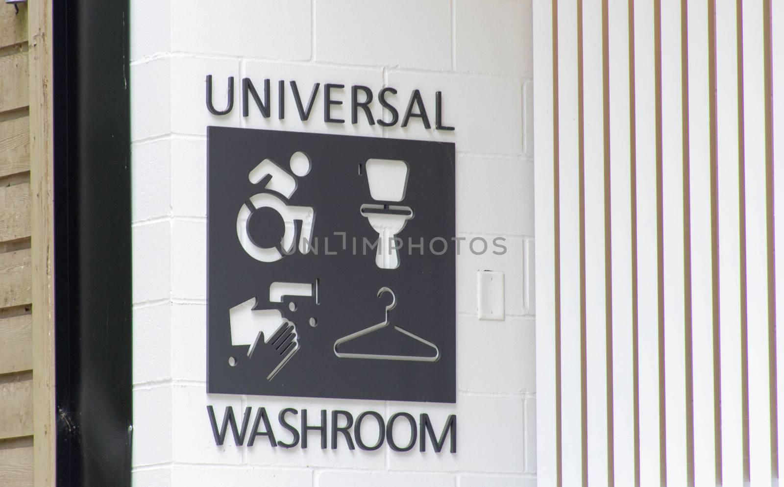 Universal bathroom or washroom sign in a public park in Canada.  by kingmaphotos