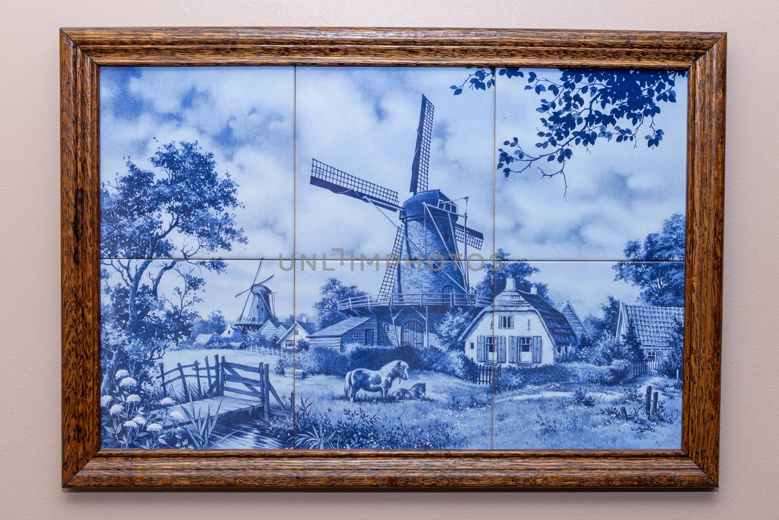 Six Delft Blue tiles in a frame, a souvenir from Holland/Netherl by kingmaphotos