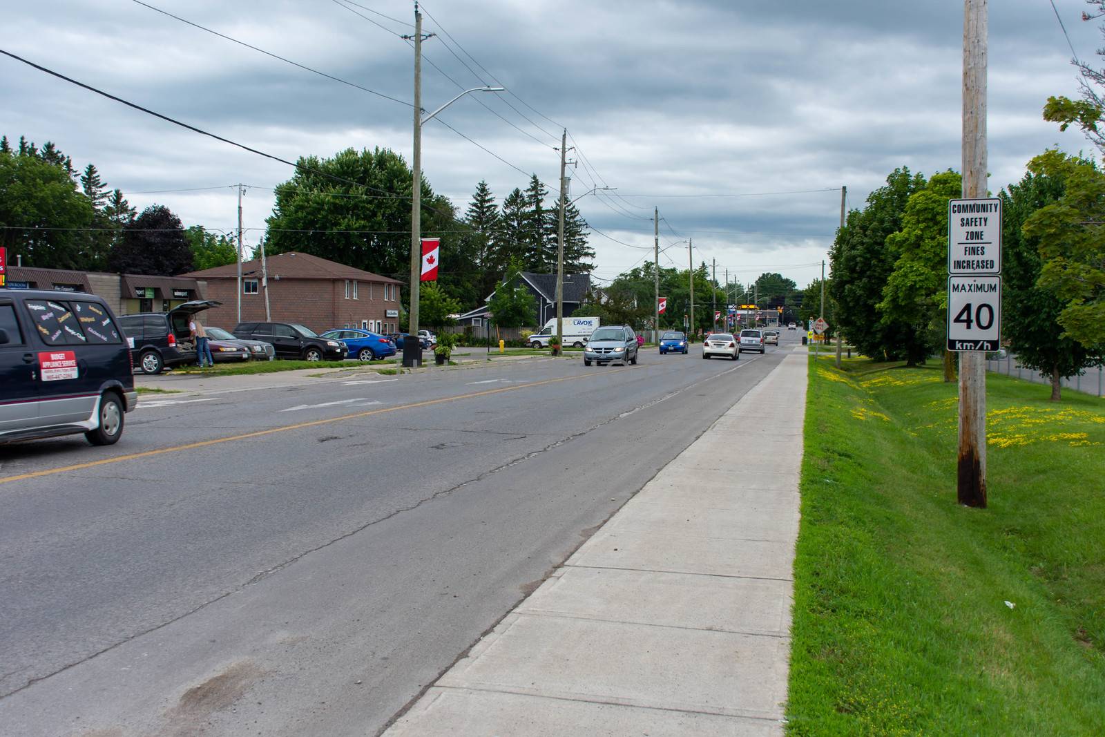"Brighton, Ontario/Canada - 07/22/2019: Downtown rural sreet of small town Canadian city of Brighton near Pesquile Lake Provincial Park in the summer cloudy and sunny day."
