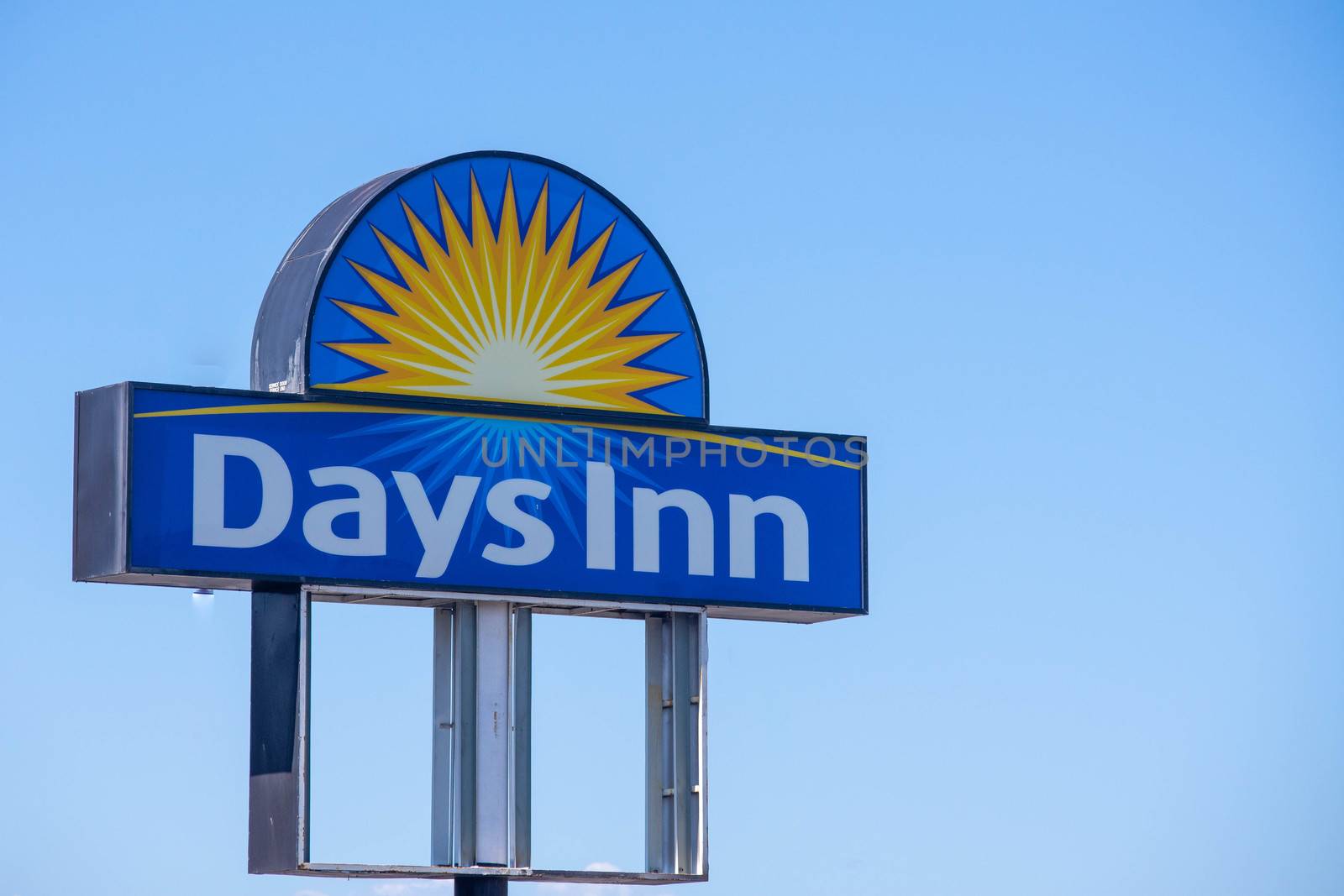 Days Inn  Hotel Sign on blue sky sunny day by kingmaphotos