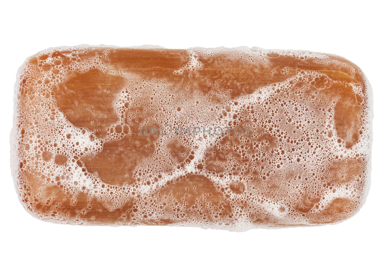 wet piece of brown tar soap isolated on white background in flat lay directly above perspective by z1b