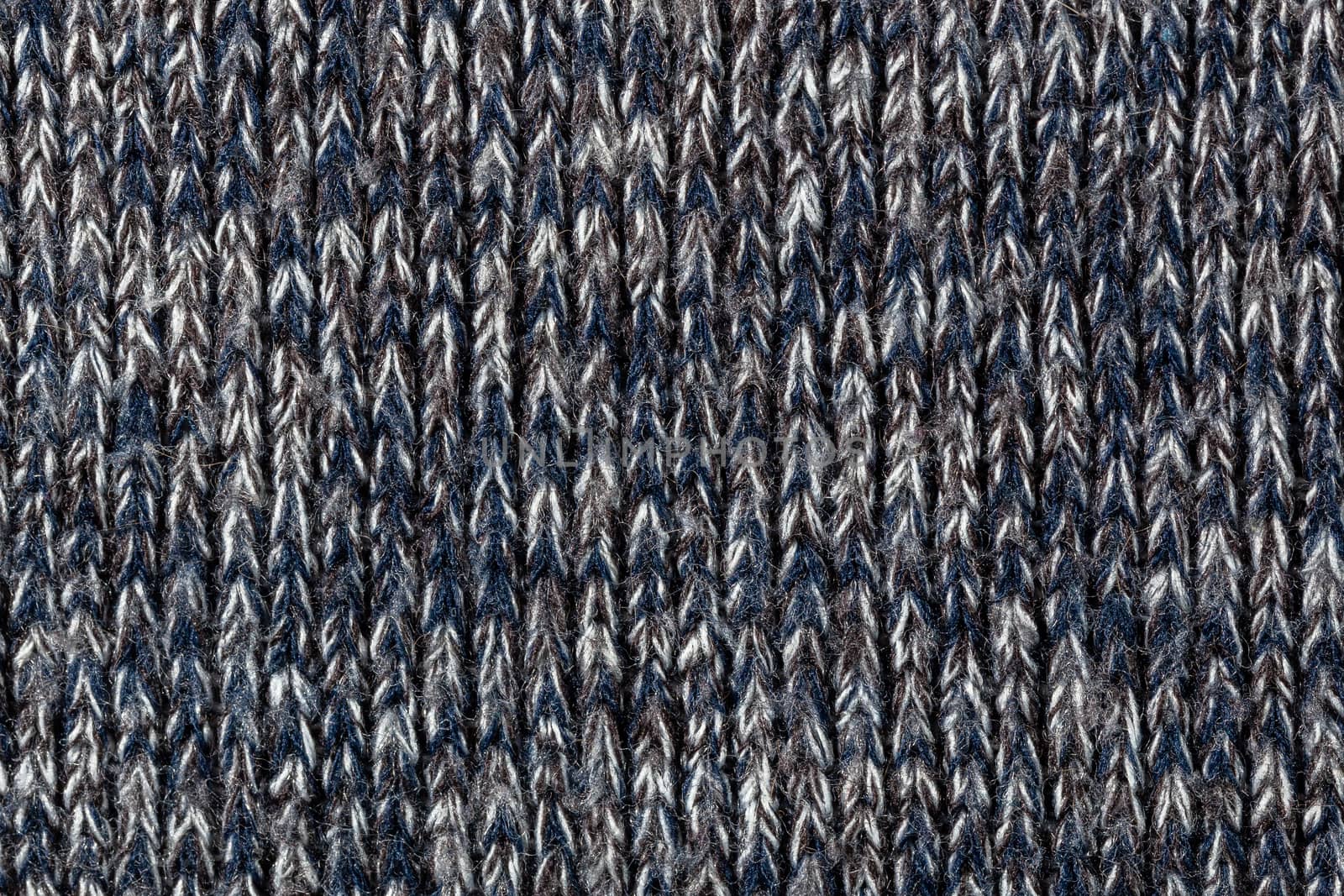 macro photo of warm gray melange polyester sweater with even vertical structure.