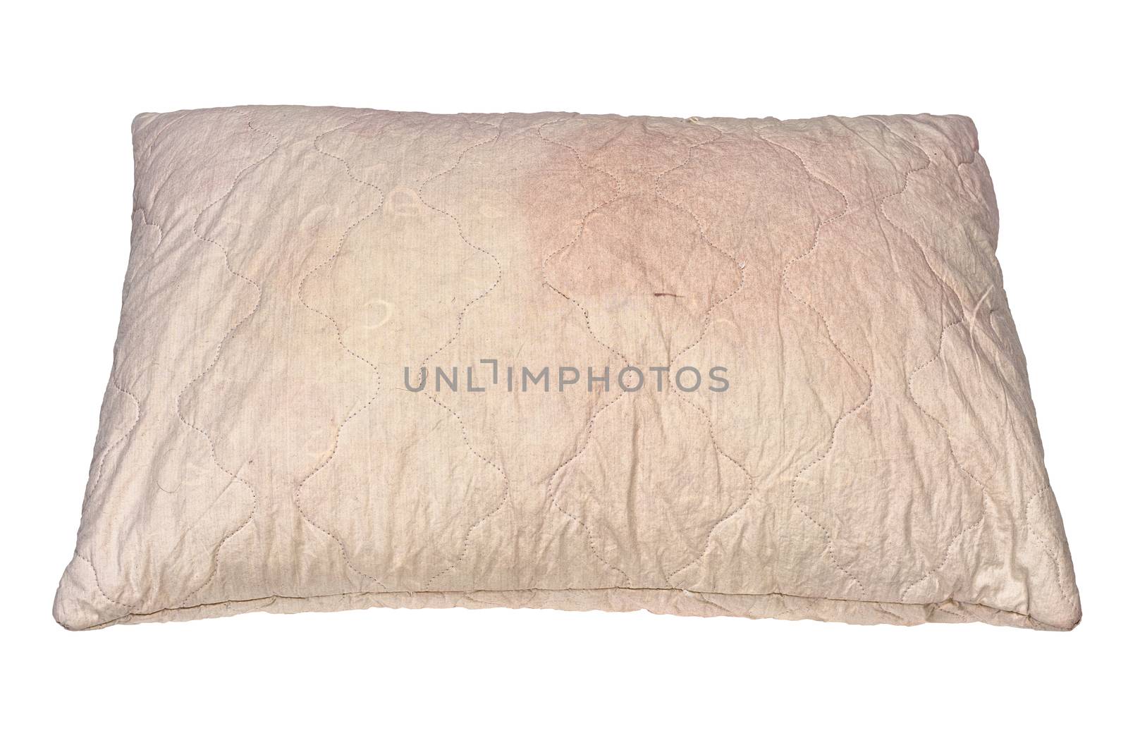 dirty used spotted pillow isolated on white background in slanted frontal perspective.