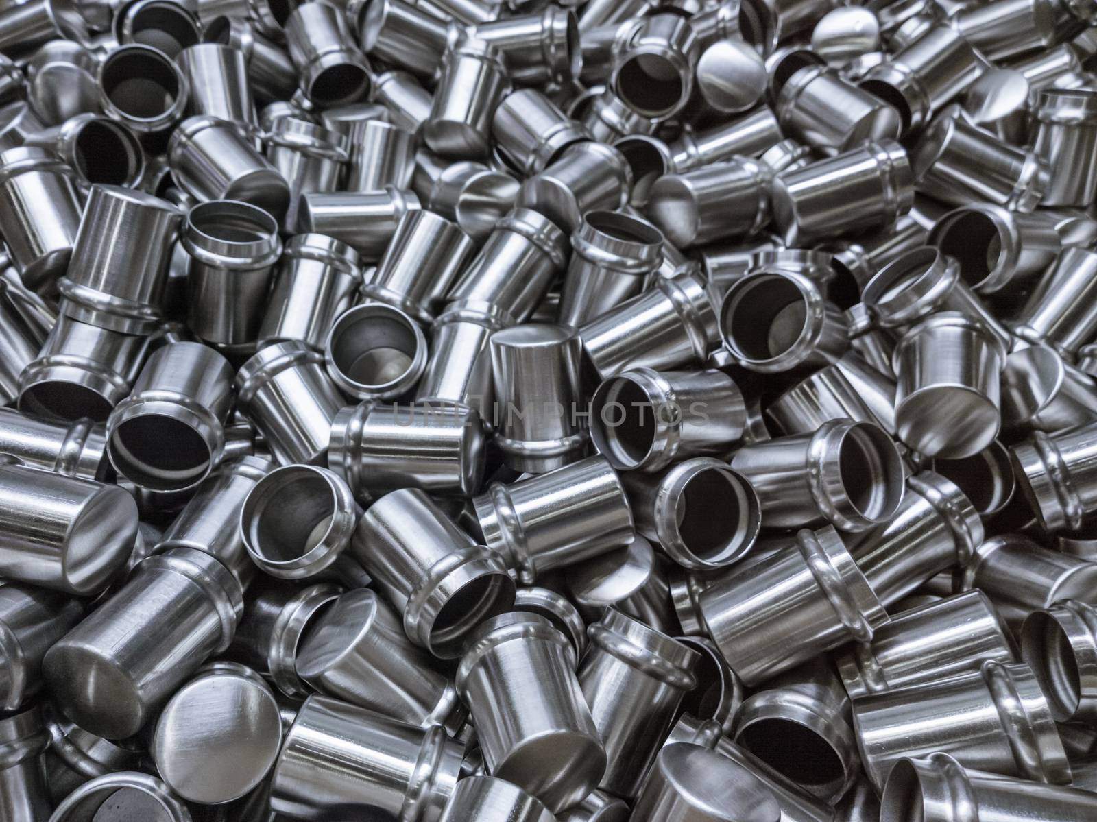 Shiny cold deformated cylindrical steel parts background by z1b