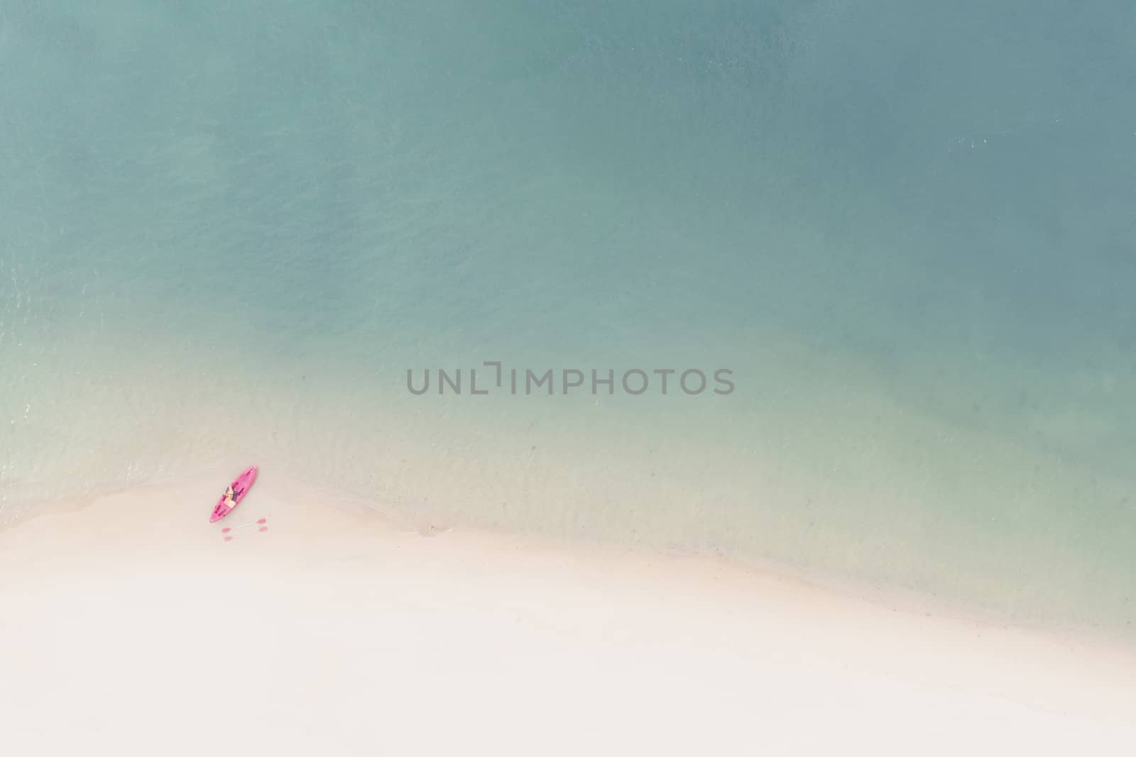 Aerial View of Sandy Beach with kayak boat with Blue Sea by Charnsitr
