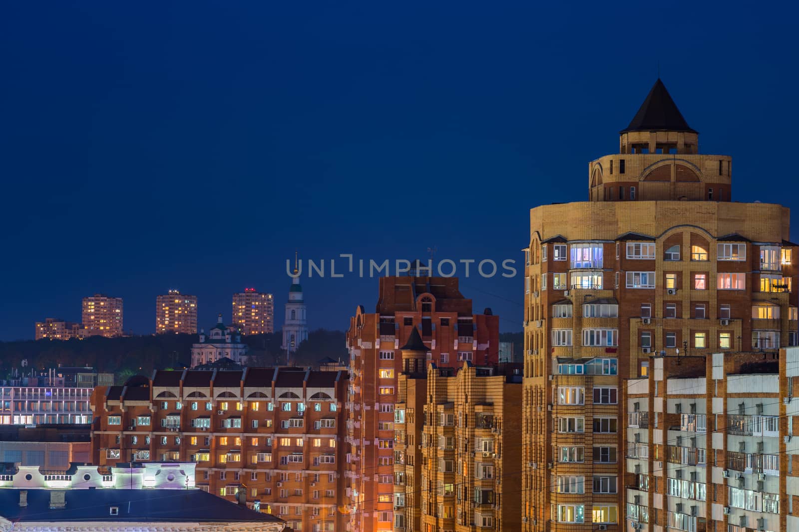 night russian Tula cityscape in telephoto with dense development