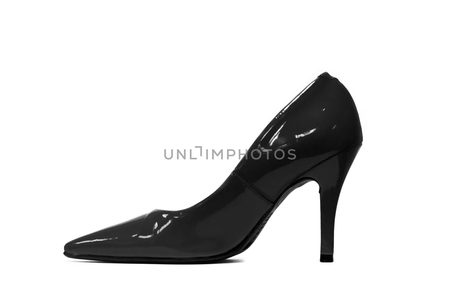Isolated black high heel shoe by Charnsitr