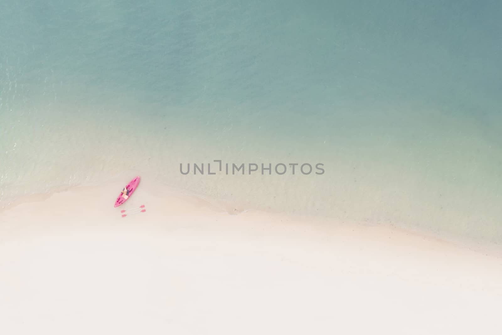 Aerial View of Sandy Beach with kayak boat with Blue Sea by Charnsitr