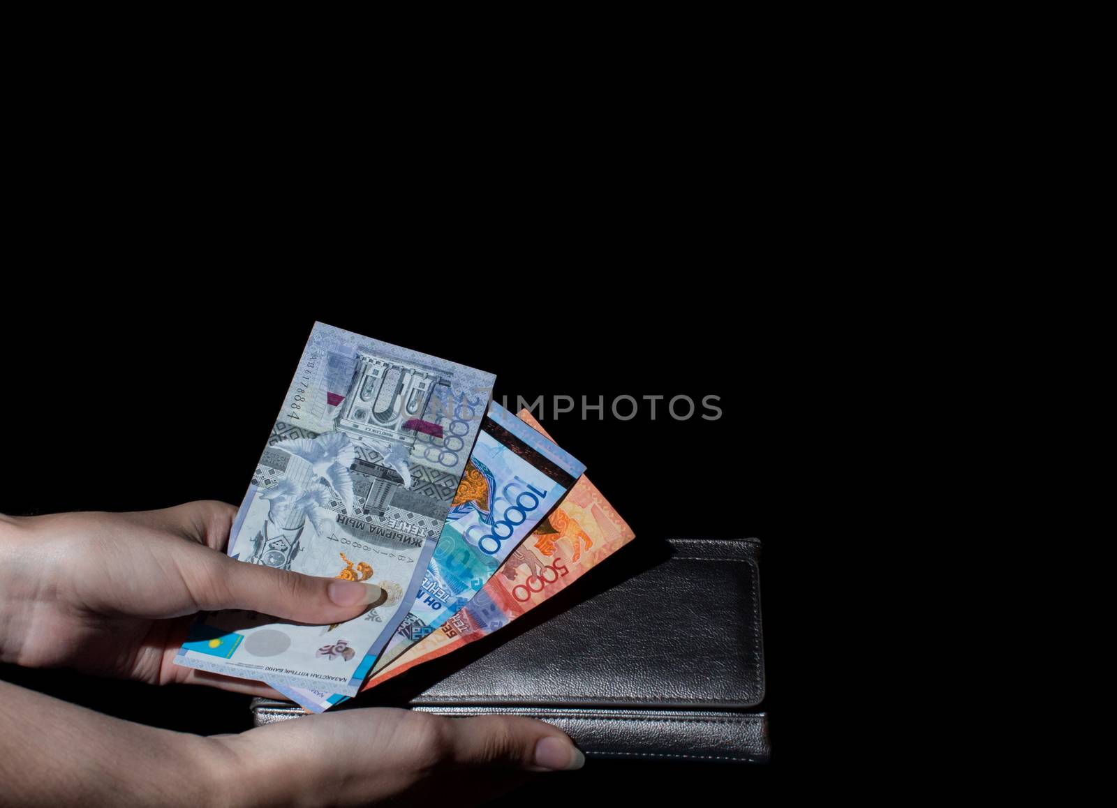 Hold wallet with money in hand. Tenge KZT. National currency of Kazakhstan, KZ. Exchange rate. Economy, development, business, Bank, broker.