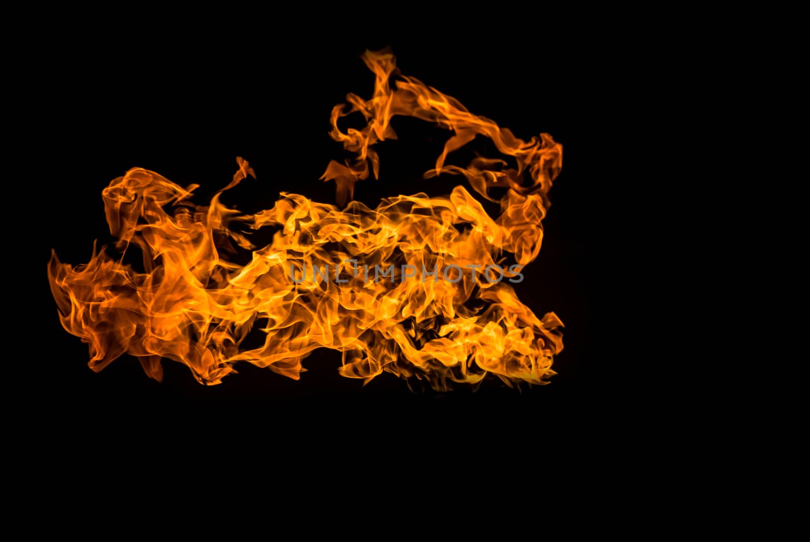 Fire on black background. Fiery patterns. Burning flame. Blazing fire.	