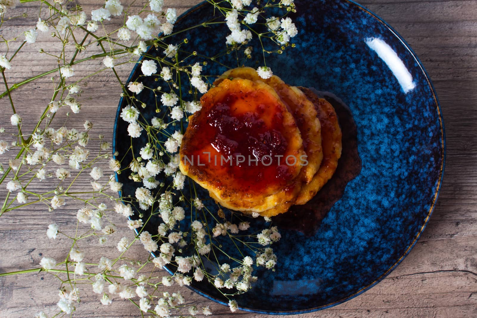 Beautiful Breakfast. Food. Pancakes with strawberry jam. Flowers and stylish dishes. A healthy life style. Flat lay. Luxury decor. Lunch, snack. Family meal. Home cooking.