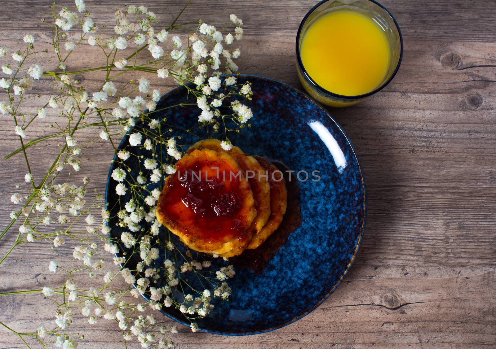 Beautiful Breakfast. Food. Pancakes with strawberry jam and orange juice. Flowers and stylish dishes. A healthy life style. Flat lay. Luxury decor. Lunch, snack. Family meal. Home cooking.