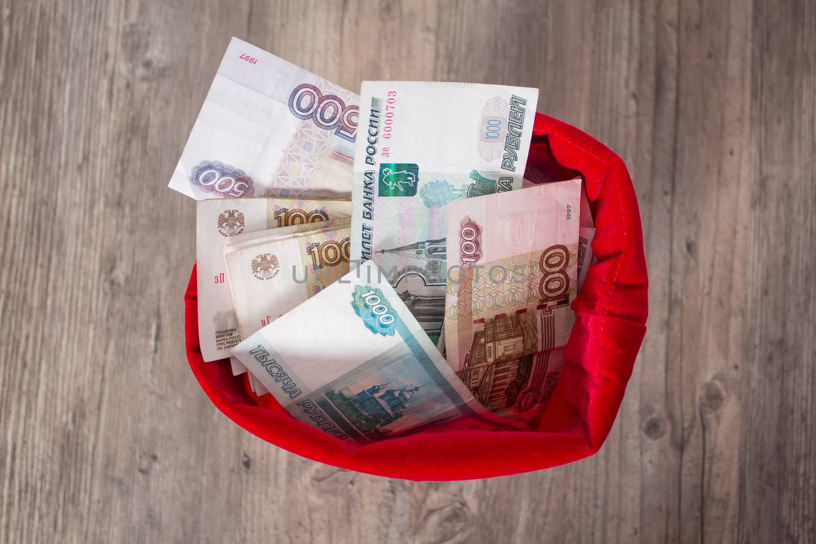Russian rubles in a red bag. Full bag of money. Banknote, currency, Bank, business, economy, investment. Salary, winnings, prize, stash,