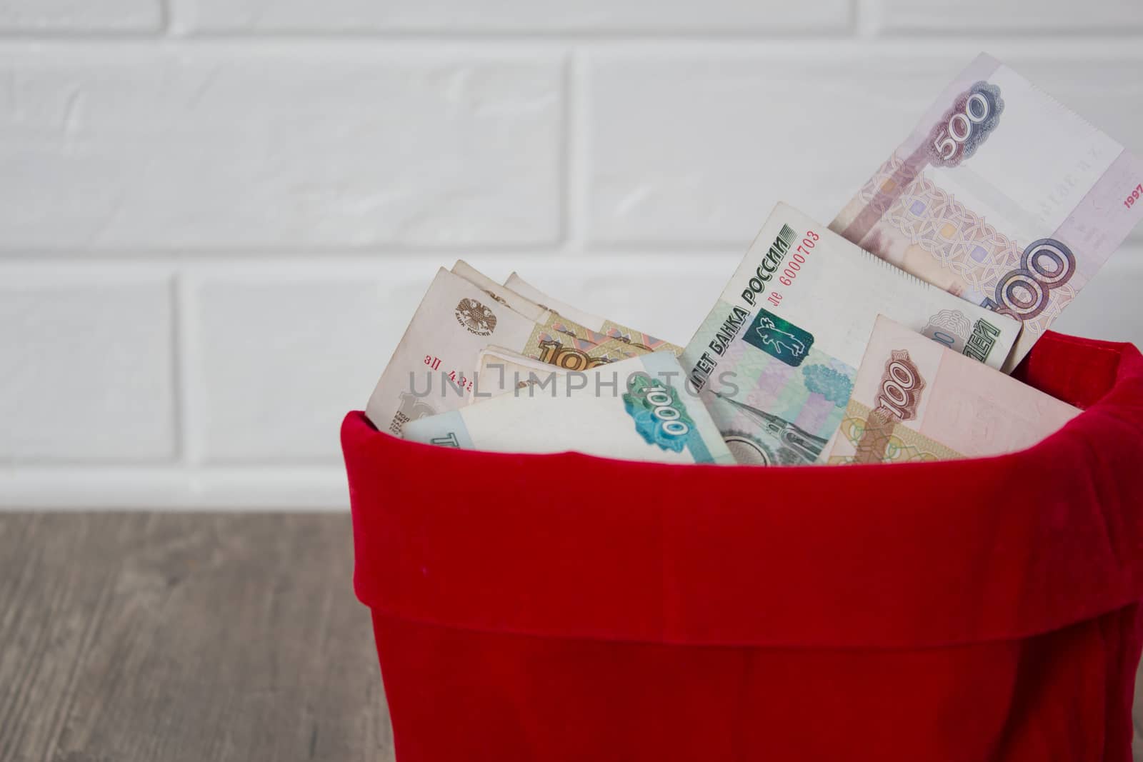 Russian rubles in a red bag. Full bag of money. Banknote, currency, Bank, business, economy, investment. Salary, winnings, prize, stash,